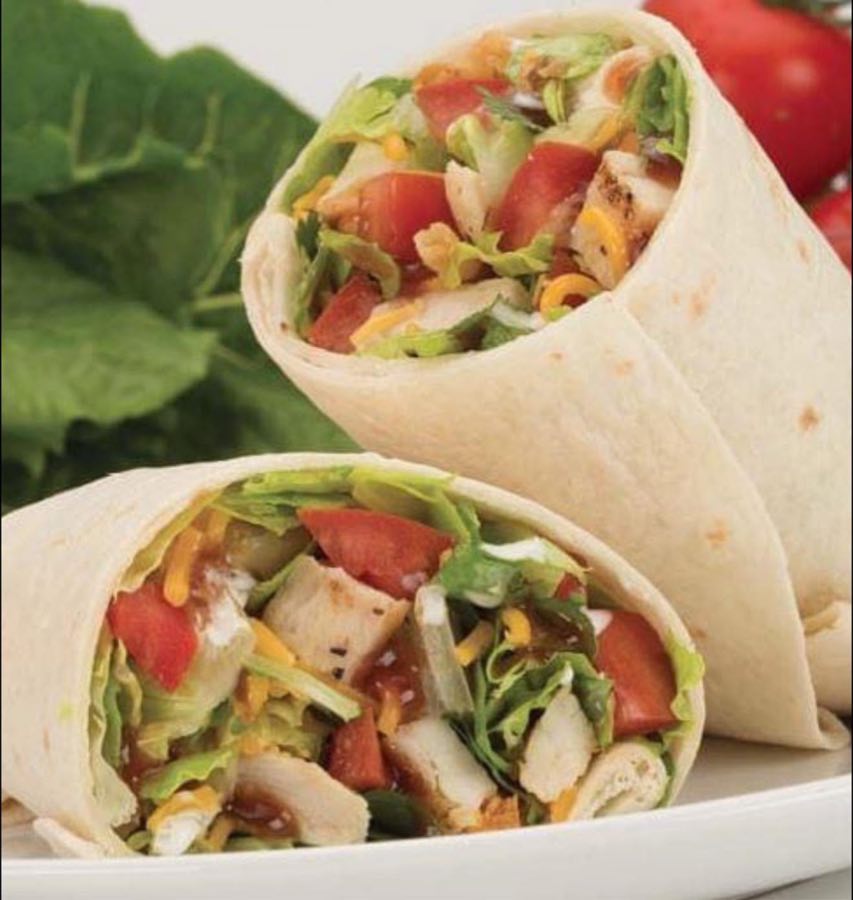 Grilled chicken wrap with lettuce, tomato, and cheddar