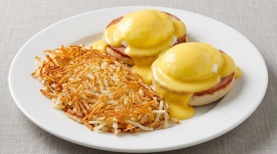 Eggs Benedict with hollandaise sauce and hash browns at Roman Castle in Mauston