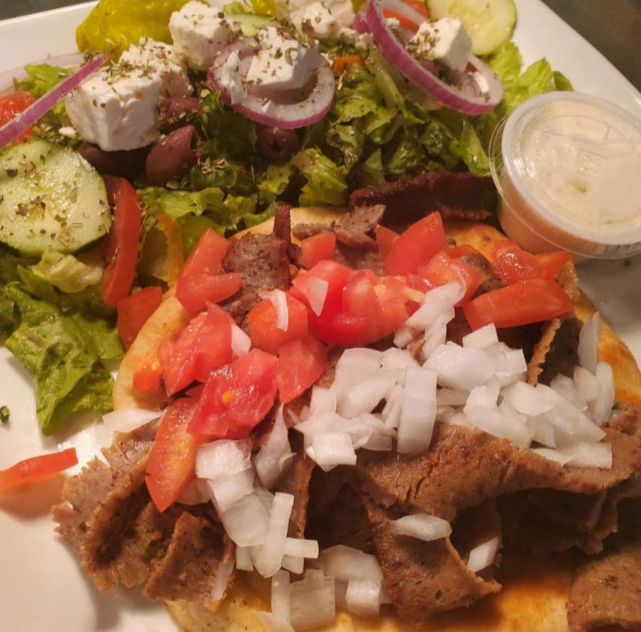 Gyro plate with pita, tomatoes, and tzatziki