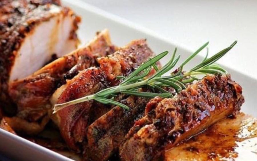 Sliced roasted pork with rosemary and pan sauce